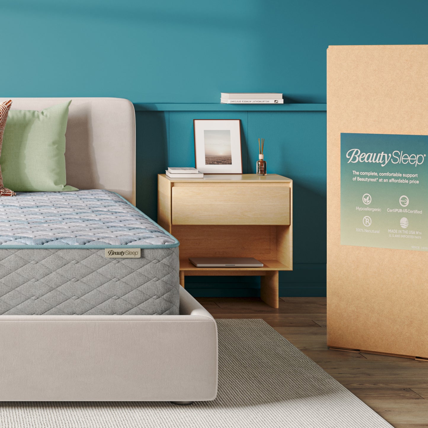 Bedroom with a mattress and BeautySleep packaging against a teal wall.