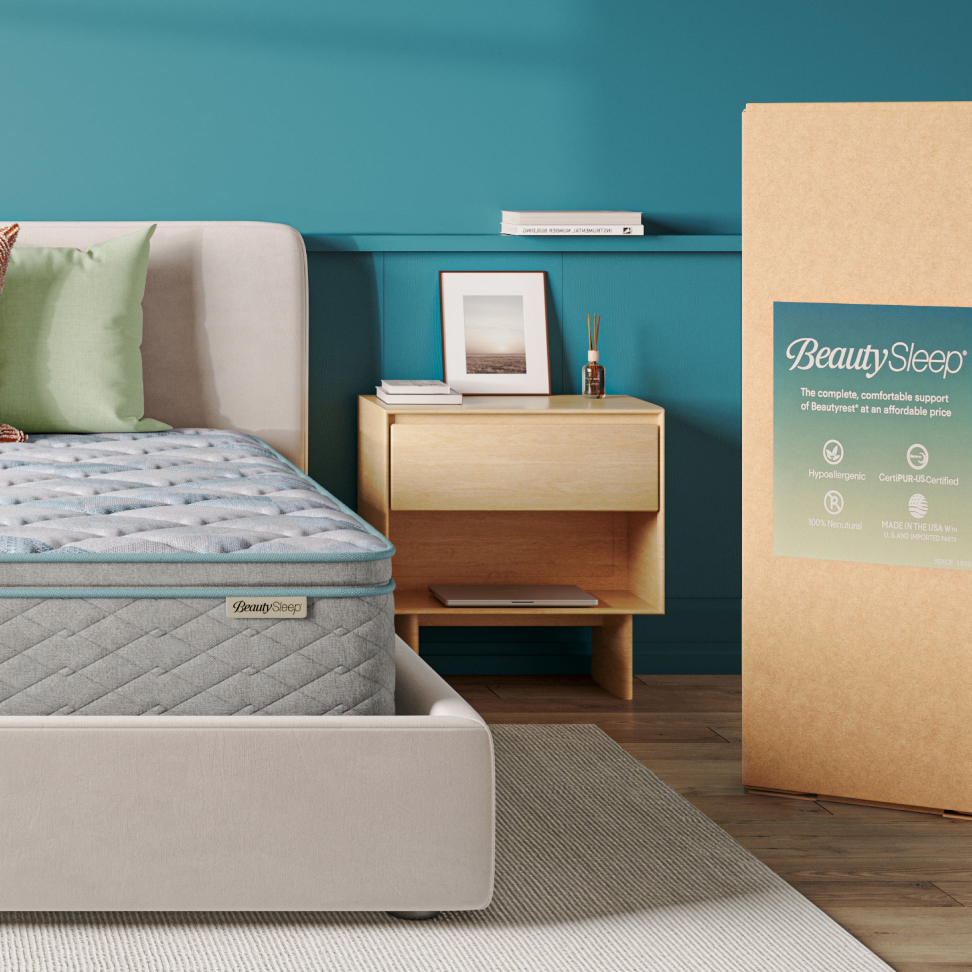 Bedroom with a mattress and BeautySleep packaging against a teal wall.