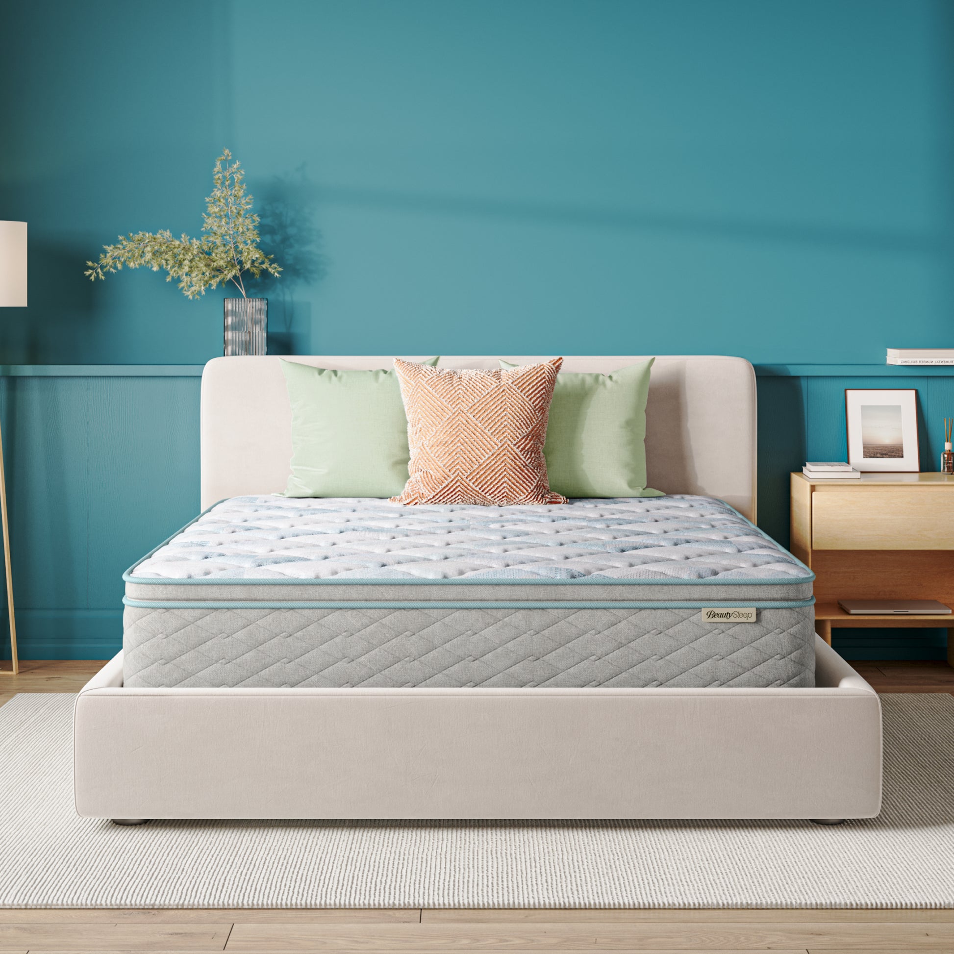 Beauty Sleep Mattress on a bed in a bedroom with teal walls and decorative elements.