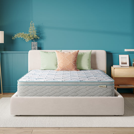 Beauty Sleep Mattress on a bed in a bedroom with teal walls and decorative elements.