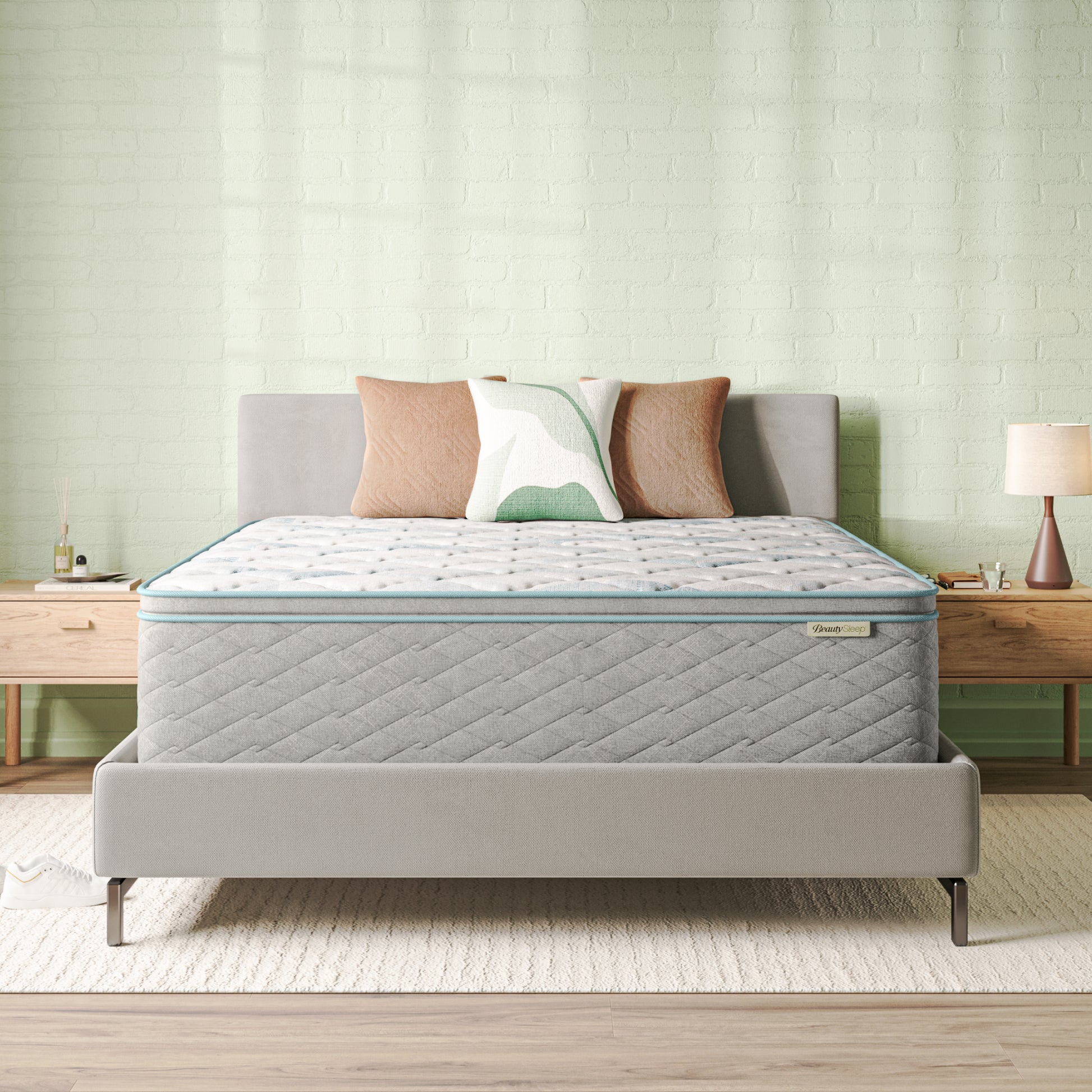 Beauty Sleep Mattress on a bed with pillows in a bedroom setting